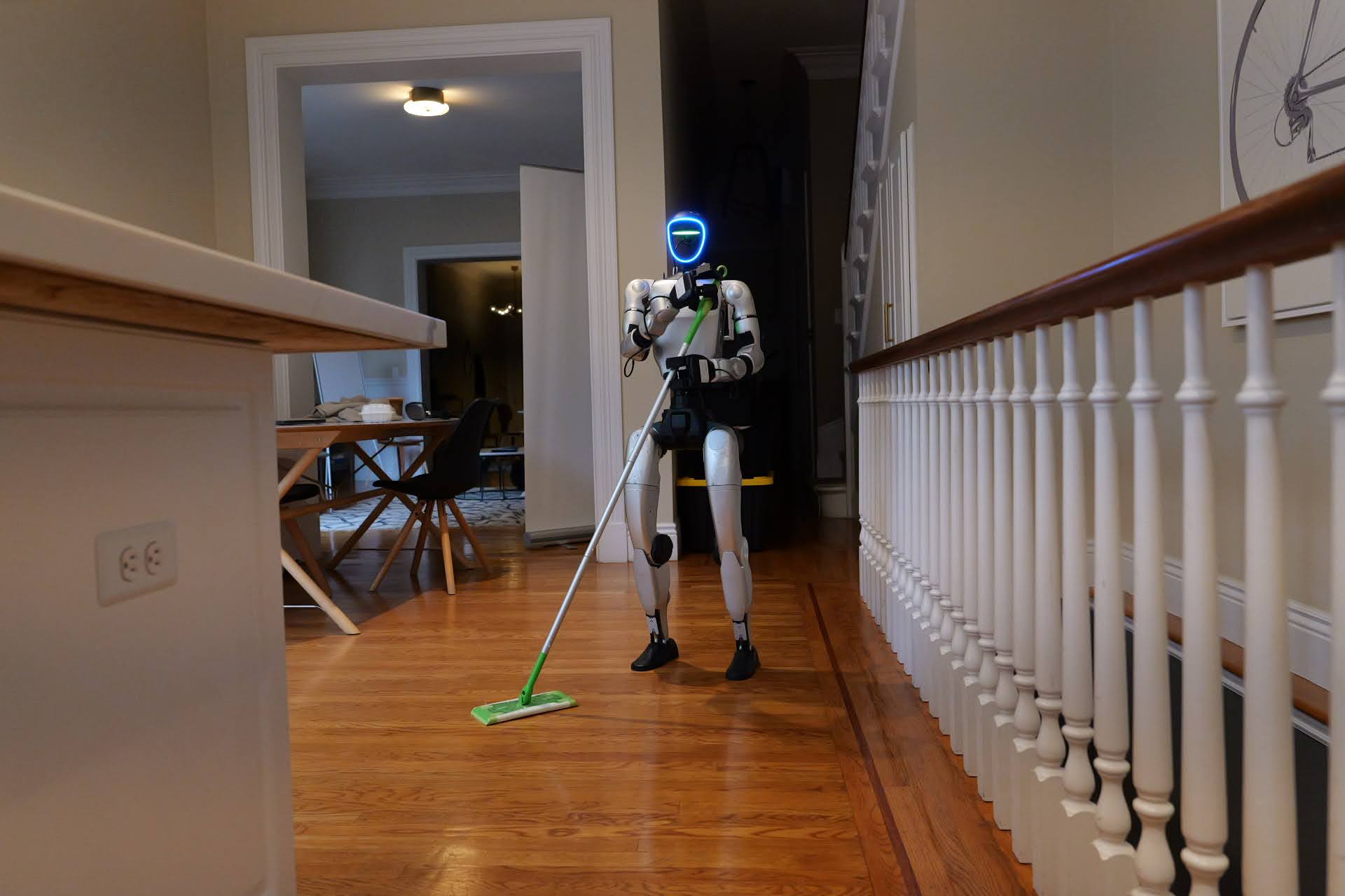 Robot mopping a hardwood hallway